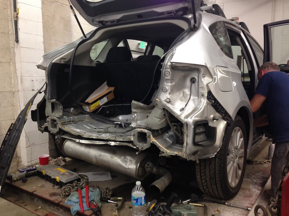 Fixing Back Of Silver Car